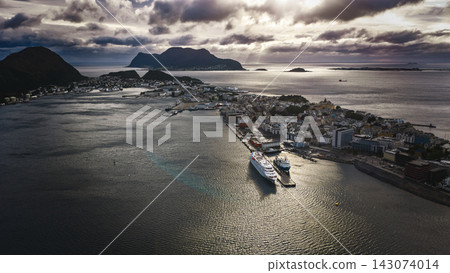 Aerial view of Alesund harbor with cruise ship and surrounding islands, Norway Aerial view of Alesund harbor with cruise ship and surrounding islands, Norway 143074014