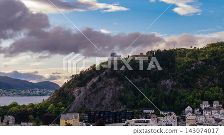 Aerial view of Fjelltun mountain observatory with forested slopes overlooking Alesund fjord, Norway Aerial view of Fjelltun mountain observatory with forested slopes overlooking Alesund fjord, Norway 143074017
