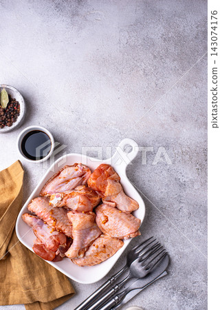 Raw uncooked chicken wings marinated Raw uncooked chicken wings marinated 143074176
