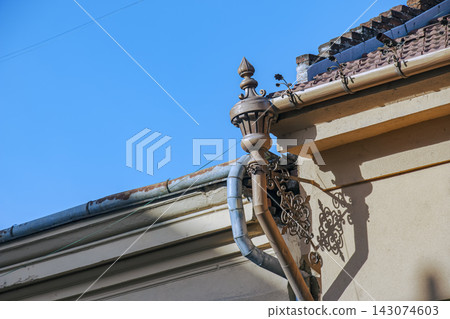 Ornamental Roof Detail and Rain Gutter Ornamental Roof Detail and Rain Gutter 143074603