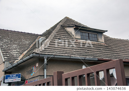 Nitra, Slovakia - January 17, 2024: Tiled Roof of a Small Building Nitra, Slovakia - January 17, 2024: Tiled Roof of a Small Building 143074636