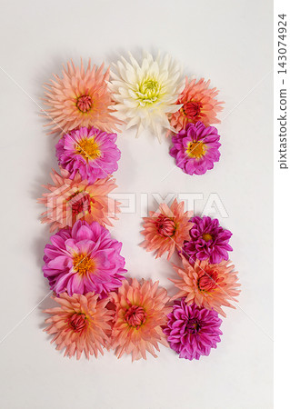 Letter G created from real, fresh dahlia flowers. Floral typography concept, floral font with colorful, vibrant flowers,A unique collection of letters and numbers for design. Creative idea for design Letter G created from real, fresh dahlia flowers. Floral typography concept, floral font with colorful, vibrant flowers,A unique collection of letters and numbers for design. Creative idea for design 143074924
