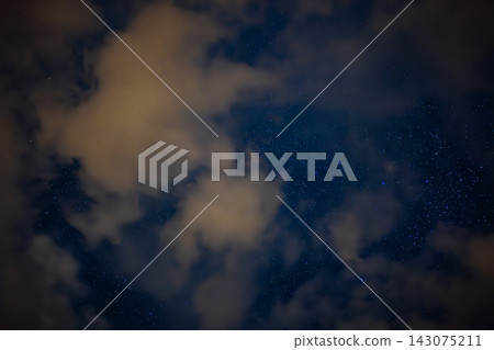 Night Sky with Scattered Stars and Illuminated Drifting Clouds Night Sky with Scattered Stars and Illuminated Drifting Clouds 143075211