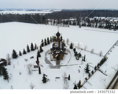 Aerial winter view of wooden Orthodox church in rural Belarus Aerial winter view of wooden Orthodox church in rural Belarus 143075332