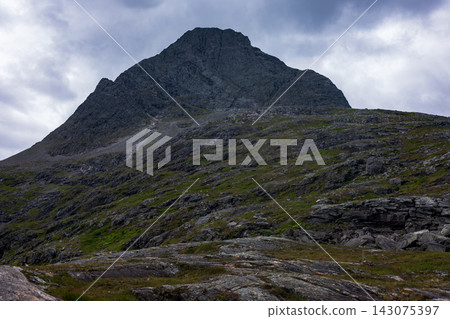 Mountain peak with scree slopes and alpine vegetation, Norway Mountain peak with scree slopes and alpine vegetation, Norway 143075397