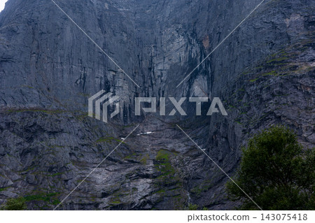 Canyon gorge with columnar basalt formations and stream, Norway 143075418