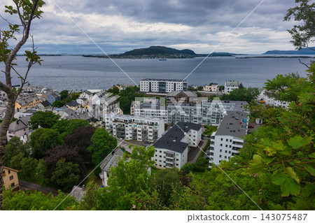 Aerial view of coastal town with modern apartments and fjord, Norway 143075487