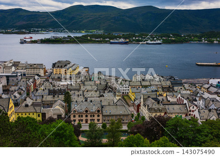 Aerial view of coastal town with fjord, mountains and cargo ships, Norway Aerial view of coastal town with fjord, mountains and cargo ships, Norway 143075490