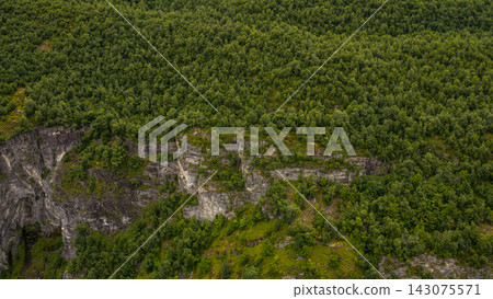 Aerial view of forested canyon with exposed rock layers near Mollsaeter, Norway Aerial view of forested canyon with exposed rock layers near Mollsaeter, Norway 143075571