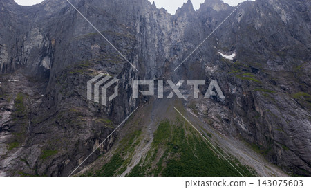Aerial view of rocky canyon with columnar basalt formations and scree slopes, Eidet Rauma Norway 143075603