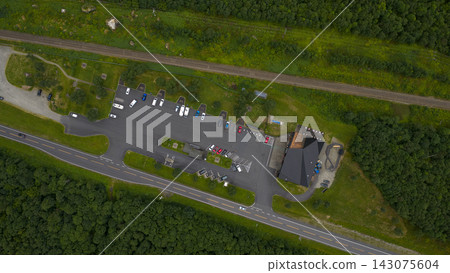Aerial view of rest area and parking lot along E6 highway, Eidet, Rauma, Norway Aerial view of rest area and parking lot along E6 highway, Eidet, Rauma, Norway 143075604