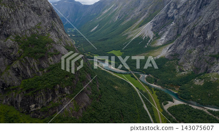 Aerial view of Romboleden valley with river and road, Rauma municipality, Norway Aerial view of Romboleden valley with river and road, Rauma municipality, Norway 143075607