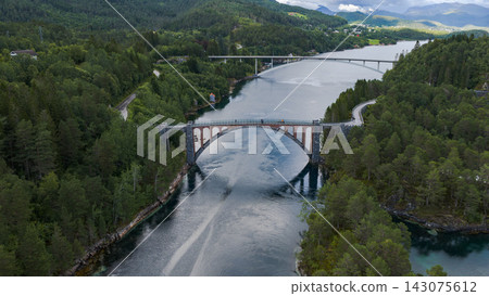 Aerial view of twin arch bridges crossing river at Straumen, Trondelag Norway Aerial view of twin arch bridges crossing river at Straumen, Trondelag Norway 143075612