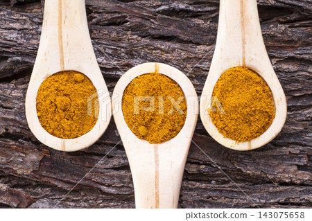 turmeric powder and roots turmeric powder and roots 143075658