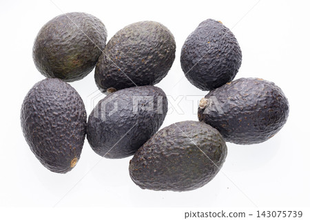 Ripe Avocados Arranged on White Background Ripe Avocados Arranged on White Background 143075739