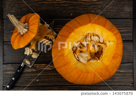 Cut pumpkin ready for decoration for Halloween celebration in autumn Cut pumpkin ready for decoration for Halloween celebration in autumn 143075870
