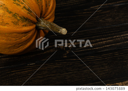Pumpkin on a rustic wooden table for autumn decoration Pumpkin on a rustic wooden table for autumn decoration 143075889
