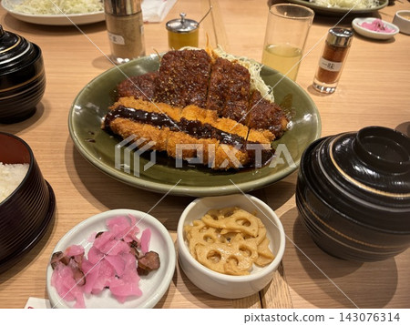 Pork cutlet set meal with sauce and a small side dish Pork cutlet set meal with sauce and a small side dish 143076314