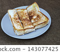 Top view of freshly grilled toasted bread served on a plate, a popular Indonesian street food snack known as ropang. 143077425