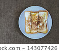 Top view of freshly grilled toasted bread served on a plate, a popular Indonesian street food snack known as ropang. 143077426
