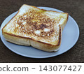 Top view of freshly grilled toasted bread served on a plate, a popular Indonesian street food snack known as ropang. 143077427
