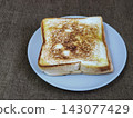 Top view of freshly grilled toasted bread served on a plate, a popular Indonesian street food snack known as ropang. 143077429