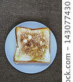 Top view of freshly grilled toasted bread served on a plate, a popular Indonesian street food snack known as ropang. 143077430