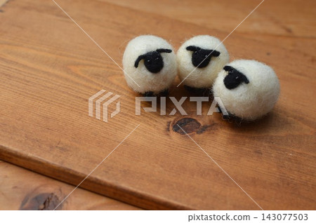 Wool felt sheep with a black face Wool felt sheep with a black face 143077503