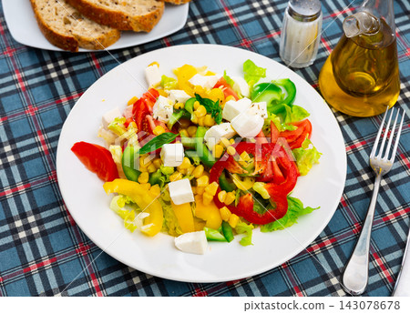 Salad with cheese, tomato, peppers, and corn Salad with cheese, tomato, peppers, and corn 143078678