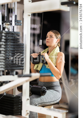 Woman doing back exercise 143078784