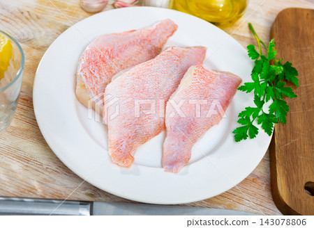 Raw rockfish fillet with condiments, cooking ingredients Raw rockfish fillet with condiments, cooking ingredients 143078806