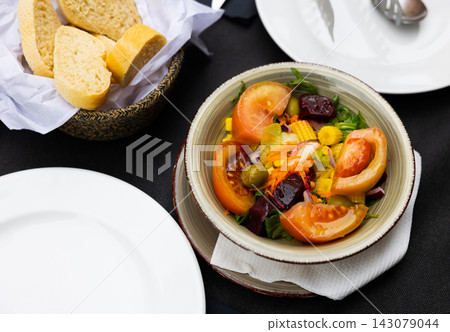 Portion of fresh salad in bowl Portion of fresh salad in bowl 143079044