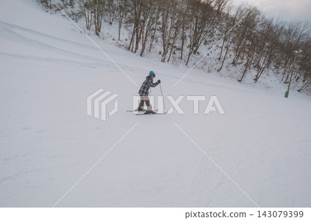 A 12-year-old boy skiing down the slopes. A 12-year-old boy skiing down the slopes. 143079399