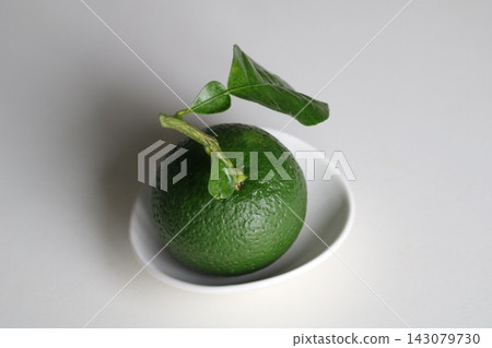 Kabosu (a type of citrus fruit) harvested from a home garden. Kabosu (a type of citrus fruit) harvested from a home garden. 143079730
