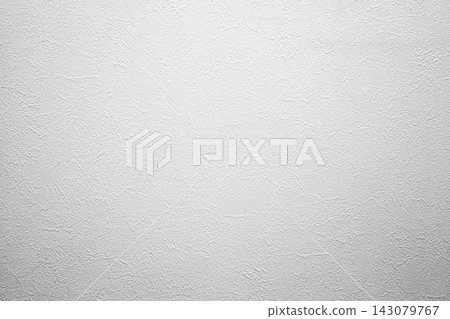 White textured wallpaper background with a fine grain and soft vignette lighting. White textured wallpaper background with a fine grain and soft vignette lighting. 143079767