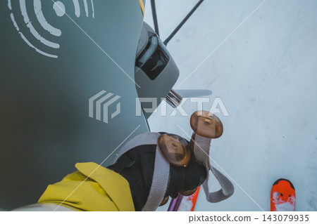 Hold your lift ticket up to the automatic lift gate at the ski resort. Hold your lift ticket up to the automatic lift gate at the ski resort. 143079935