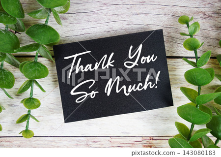 Thank You So Much! text written on paper card top view on wooden background Thank You So Much! text written on paper card top view on wooden background 143080183