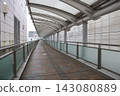 April 30 2026 Covered pedestrian walkway with curved canopy and modern architecture 143080889
