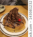Chocolate cake on top of pancakes 143081232