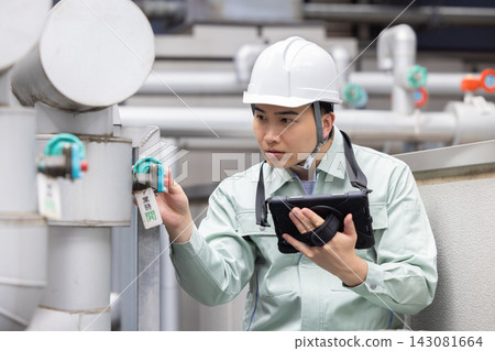 Building maintenance: A man inspecting equipment. Photo courtesy of Denpa Gakuen, Tokyo Electronics College. Building maintenance: A man inspecting equipment. Photo courtesy of Denpa Gakuen, Tokyo Electronics College. 143081664