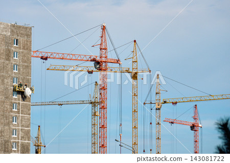 Sustainable urban development construction site with tower cranes and green building standards Sustainable urban development construction site with tower cranes and green building standards 143081722