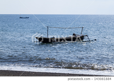 Wooden Fishing Boat on the Sea Wooden Fishing Boat on the Sea 143081884