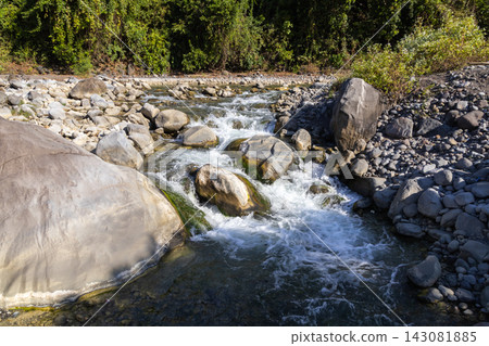 Mountain stream with big rocks and trees Mountain stream with big rocks and trees 143081885