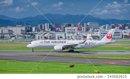 A Japan Airlines (JAL) Airbus A350 passenger aircraft begins takeoff from runway A at Fukuoka Airport. A Japan Airlines (JAL) Airbus A350 passenger aircraft begins takeoff from runway A at Fukuoka Airport. 143082615