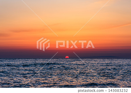 The sunset paints the Sea of Japan crimson; a fantastic sunset view from Takise Beach. The sunset paints the Sea of Japan crimson; a fantastic sunset view from Takise Beach. 143083232