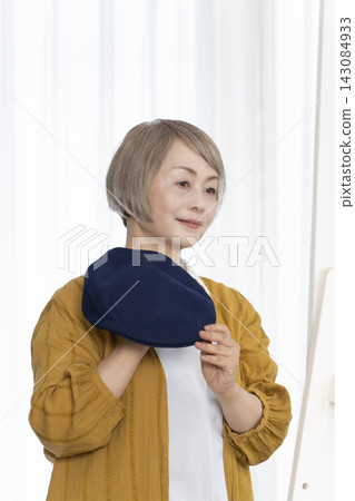 Senior women choosing hats and dressing stylishly Senior women choosing hats and dressing stylishly 143084933