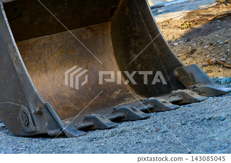 Close up excavator bulldozer bucket on construction site Close up excavator bulldozer bucket on construction site 143085045
