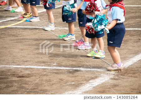 Image of kindergarten children dancing at a sports day. 143085264