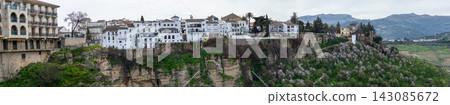 Panoramic view of surrounding landscapes and mountains from scenic elevated viewpoint in Ronda, Spain. 143085672