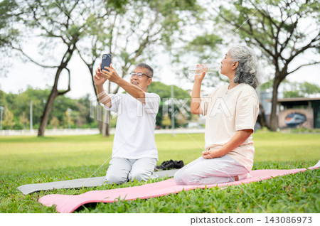 Senior Couple Yoga Mat Selfie Water Outdoor Park. Senior Couple Yoga Mat Selfie Water Outdoor Park. 143086973